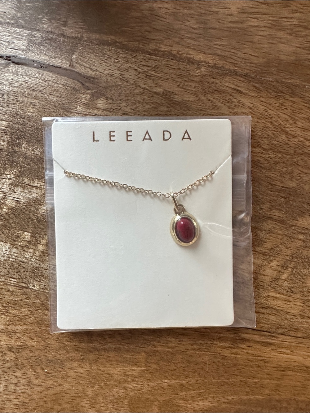 Gold Oval Pendant Necklace with Red Stone